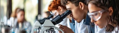 Students in front of a microscope